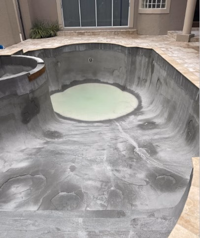 Worn, stained pool plaster before resurfacing